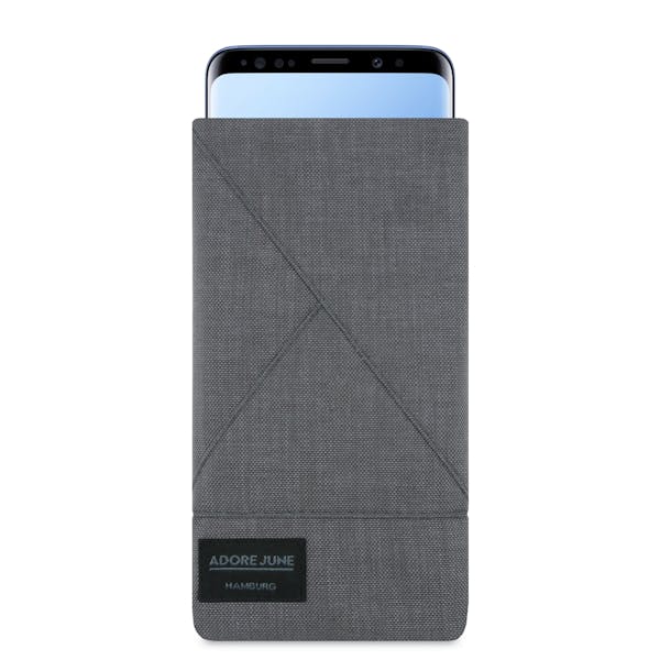 The picture shows the front of Triangle Sleeve for Samsung Galaxy S9 in color Dark Grey; As an illustration, it also shows what the compatible device looks like in this bag