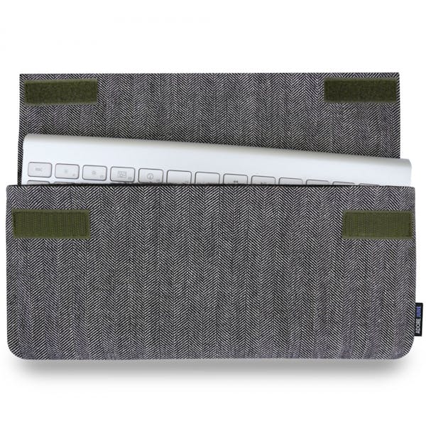 The picture shows the front of Keeb Business Sleeve for Apple Wireless Keyboard 1st Gen in color Grey / Black; As an illustration, it also shows what the compatible device looks like in this bag